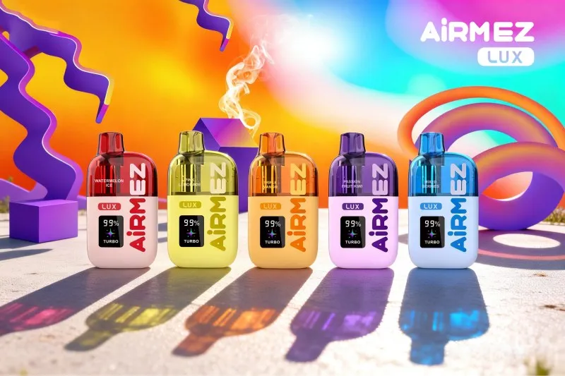 Airmez LUX disposable vape shown in five color variants and flavor options arranged on a bright surface with shadows and reflections, featuring a modern rounded design and digital display on the front.